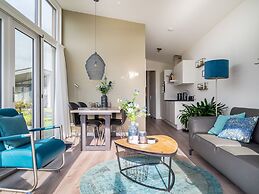 Bungalow With an Outdoor Fireplace by Water