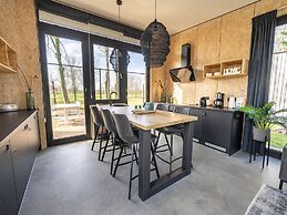 Modern Chalet by the River Maas
