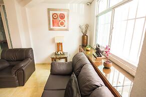 Suites Poliforum Inn