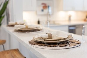 50% off New Waterfront Oasis Mins Beach, Eats, Shop