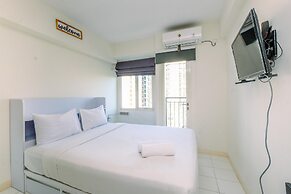 Warm and Cozy Design Studio at Podomoro Golf View Apartment