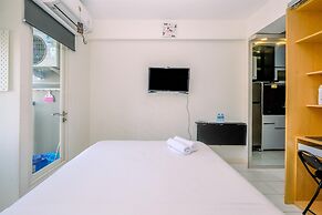 Warm and Cozy Design Studio at Podomoro Golf View Apartment