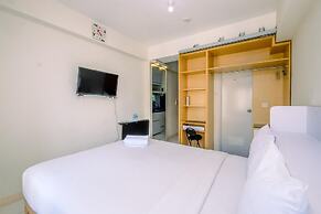 Warm and Cozy Design Studio at Podomoro Golf View Apartment