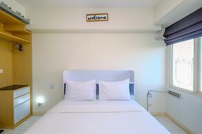 Warm and Cozy Design Studio at Podomoro Golf View Apartment