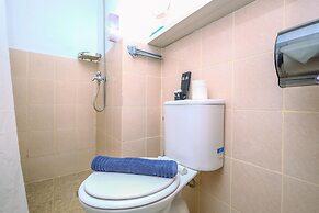 Warm and Cozy Design Studio at Podomoro Golf View Apartment