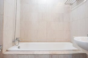 Elegant and Comfy 1BR with Extra Room Apartment at Bellagio Residence