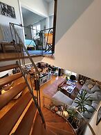Chic 2BR Bright Penthouse With Open Wood Staircase
