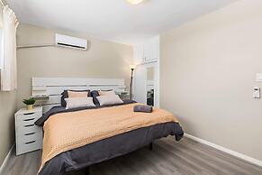 Modern Retreat With Spacious Yard & Cozy Interiors