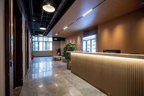 Xingyi Chain Hotel Jiangxia Metro Station