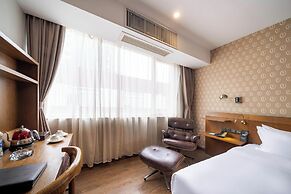 Xingyi Chain Hotel Jiangxia Metro Station