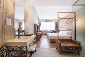 Xingyi Chain Hotel Jiangxia Metro Station