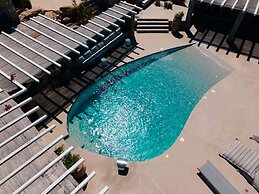 Kounoupas Complex by Mykonos Rocks