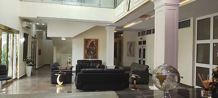 ADJ ROYALTY HOTELS & SUITES LTD