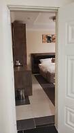 ADJ ROYALTY HOTELS & SUITES LTD