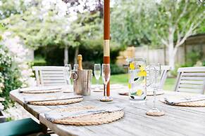 Charming Beach Getaway - Spacious 4BR Sunny Garden