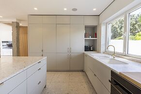 Contemporary Restelo Pool Haven by Cadenzalux