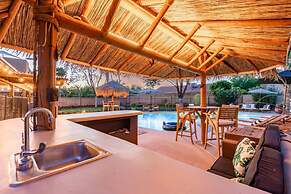 Tiki Paradise w Htd Pool Putt Grn Tiki Bar