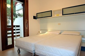 Excellently Equipped row House With Fenced Garden for 8 in Lignano Pin