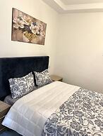 Cozy 1BR Retreat, Steps to Sand