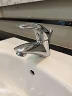 Swiss Garden Residences by Roomy