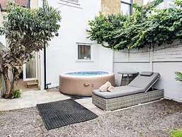 Central 3BR Home with Hot Tub Sleeps 10