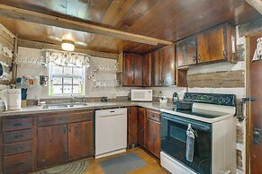 Hot Tub & Creek Views: Secluded Perryville Cabin