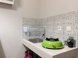 Minimalist And Cozy 1BR at Royal Heights Apartment