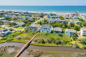 Walk to Beach: Oak Island Retreat w/ 210-yard Dock