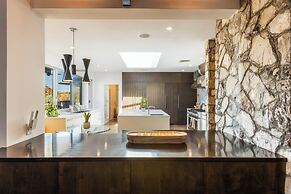 Stylish Hillside Retreat with Pool & Views