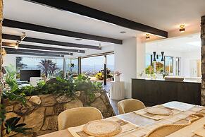 Stylish Hillside Retreat with Pool & Views