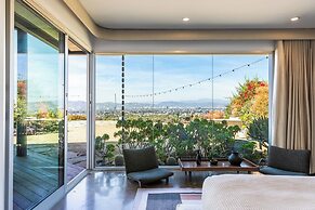 Stylish Hillside Retreat with Pool & Views