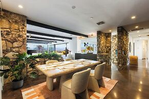 Stylish Hillside Retreat with Pool & Views
