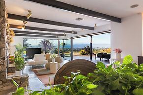 Stylish Hillside Retreat with Pool & Views