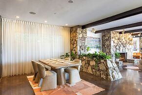 Stylish Hillside Retreat with Pool & Views