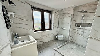 Apartamenty Sun & Snow Zasypane Mazury