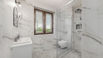 Apartamenty Sun & Snow Zasypane Mazury