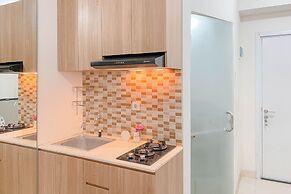 Warm and Well Designed Studio Room at Green Pramuka City Apartment
