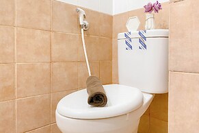 Warm and Well Designed Studio Room at Green Pramuka City Apartment