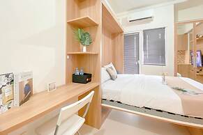 Warm and Well Designed Studio Room at Green Pramuka City Apartment