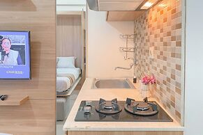 Warm and Well Designed Studio Room at Green Pramuka City Apartment
