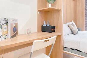 Warm and Well Designed Studio Room at Green Pramuka City Apartment