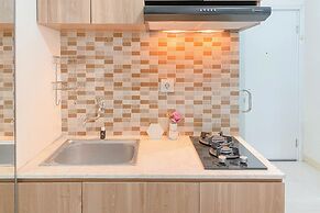 Warm and Well Designed Studio Room at Green Pramuka City Apartment