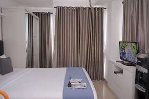 Comfortable and Warm Studio at Poris 88 Apartment