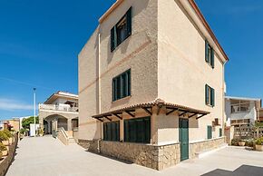 Large Seaside Apartment With Patio in Lu Bagnu