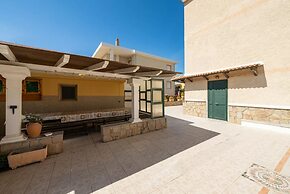 Large Seaside Apartment With Patio in Lu Bagnu