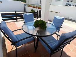 Apartamentos piscina compartida