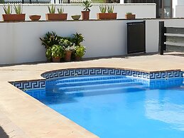 Apartamentos piscina compartida