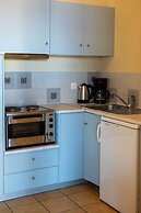 Sunny Studio Nestled Near a Refreshing Shared Pool