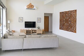 Tropical Poolside Retreat by Sea N' Rent