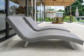 Tropical Poolside Retreat by Sea N' Rent